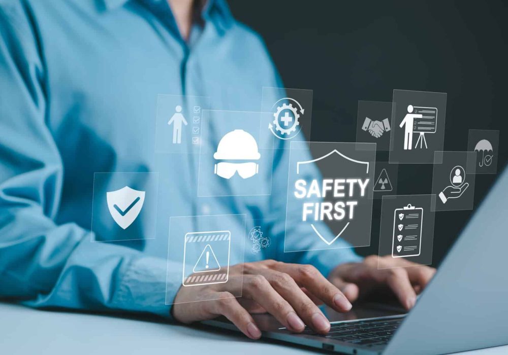 Safety,First,Concept.,Work,Safety,,Man,Typing,On,Laptop,With
